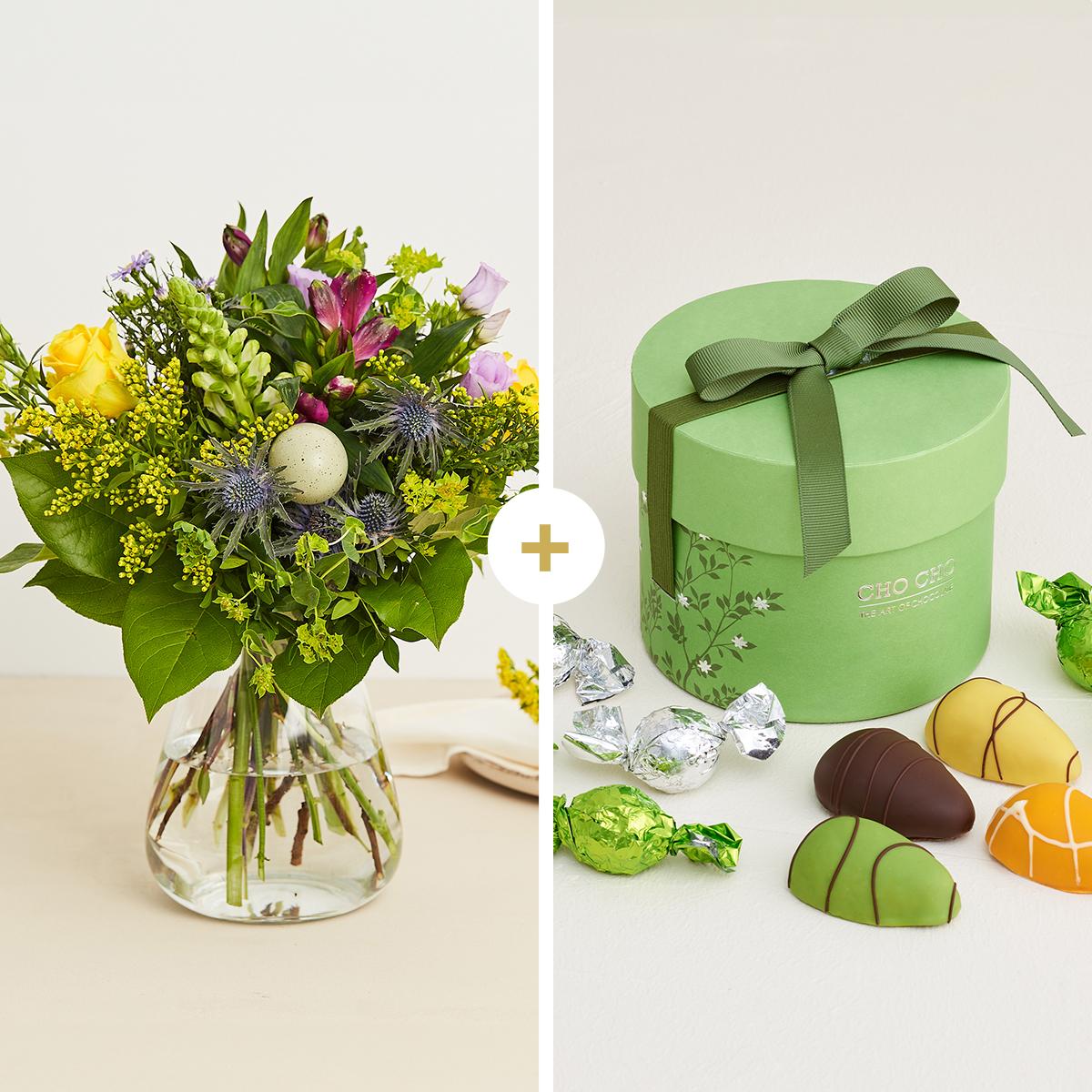 Den pæne påskehilsen med forårsæske med chokolade